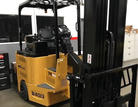Yellow forklift in warehouse