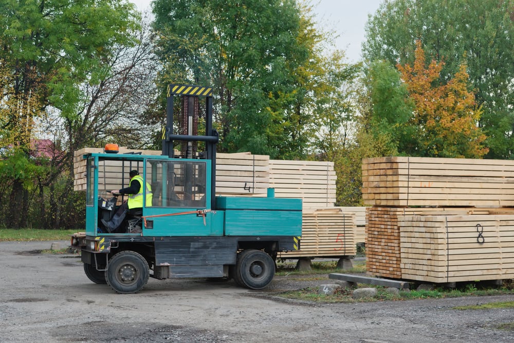 Green,Forklift,Transports,The,Boards,At,The,Plant,For,Woodworking. Forklift Hour Meter